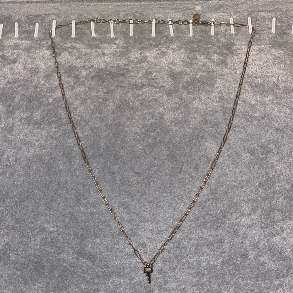 long gold chain with key charm